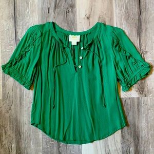 Emerald green blouse from Anthropologie.